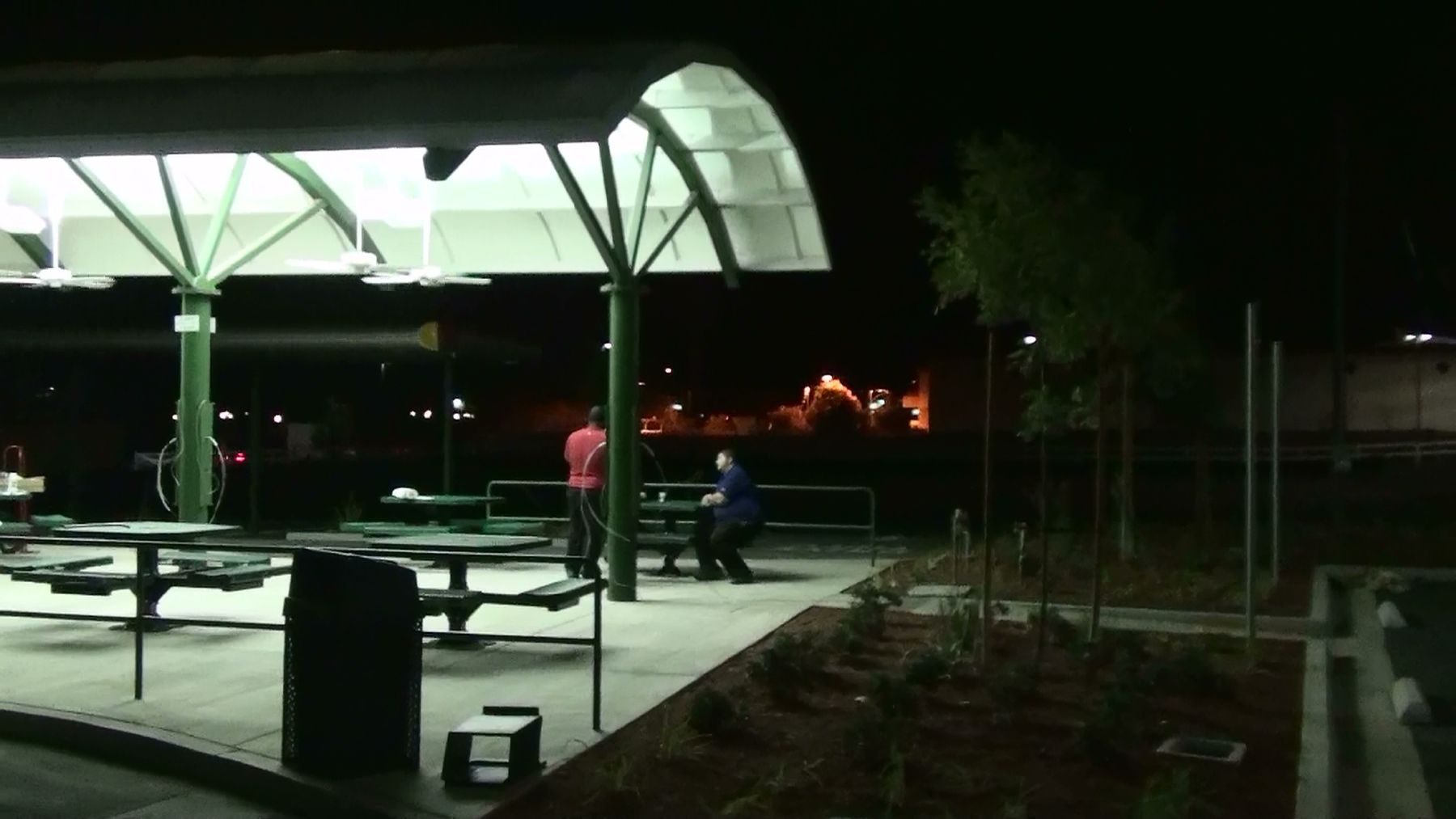 Restaurant patio with outdoor speakers at night