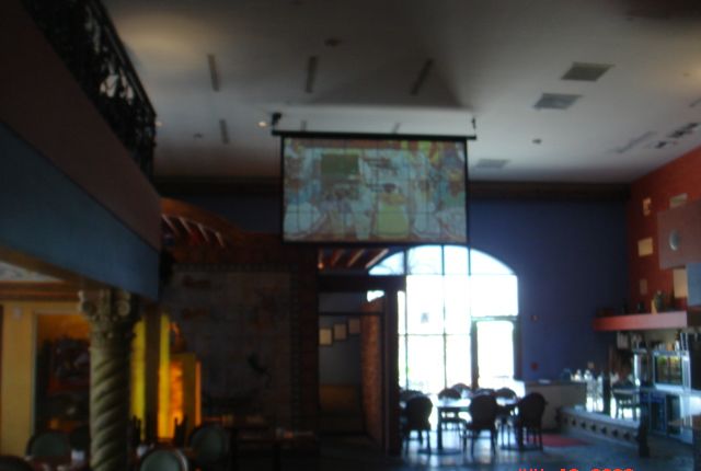Large projection screen in a restaurant dining room