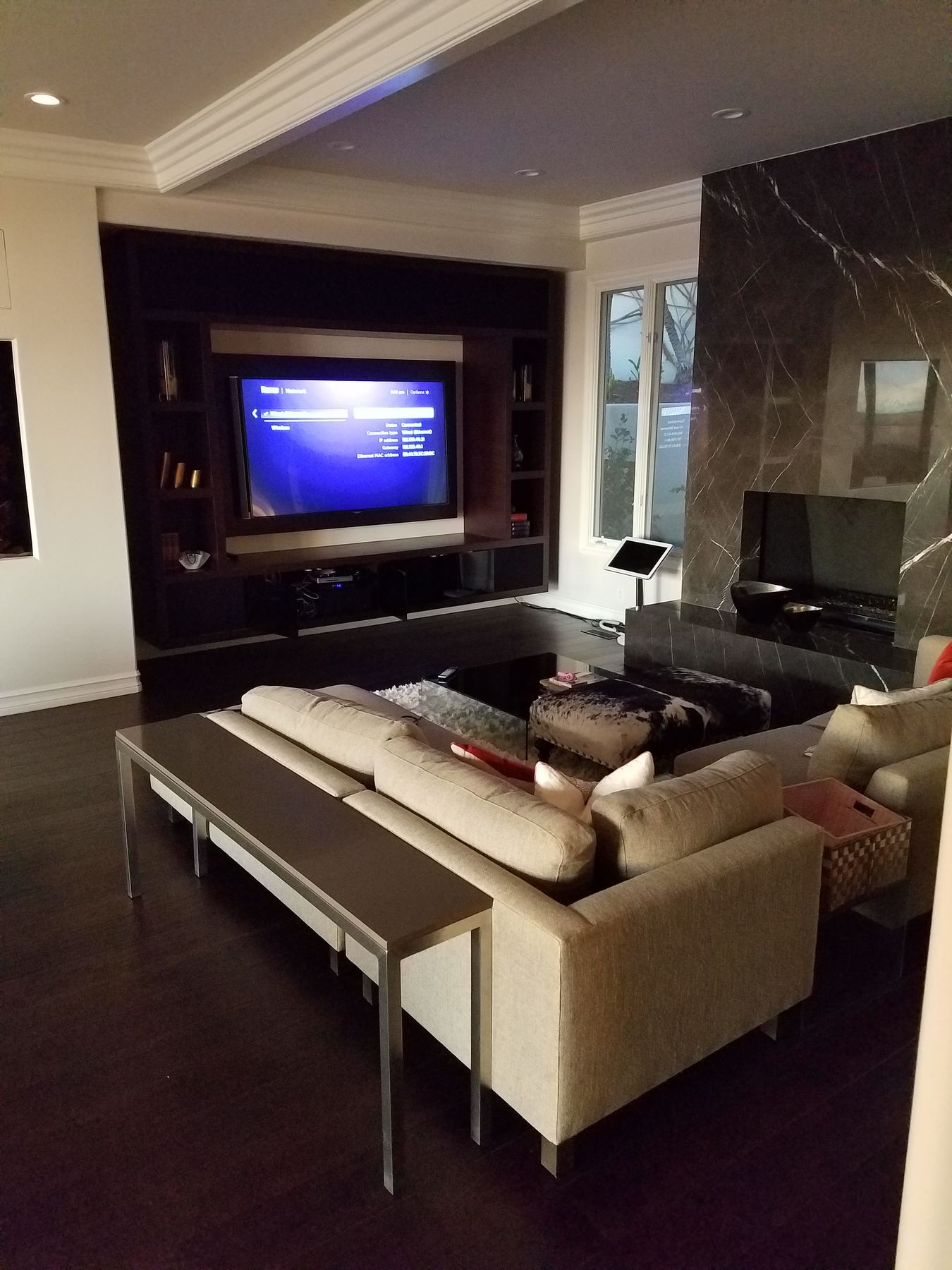 Living room with a built-in media wall and wall-mounted TV