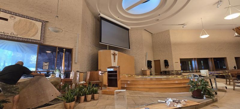 300-inch motorized projection screen installed high above the altar in a church sanctuary with a domed skylight